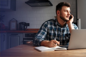 Man on phone and computer